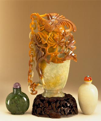 Celadon Chained Vase and Cover With a Phoenix Carved from the Russet colour.