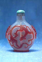 Ruby red overlay glass snuff bottle cameo carved as a dragon