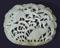 A mutton fat nephrite belt plaque undercut and well carved as storks and millet. Ming dynasty.