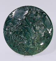 Spinach green jade circular screen with figures in a mountain landscape. Qianlong period.