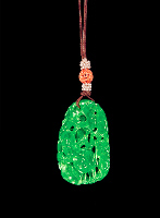 Jadeite Pendant, bright green, carved and pierced with bamboo, prunus and ruyi fungus with a tropical long tailed bird down one side.