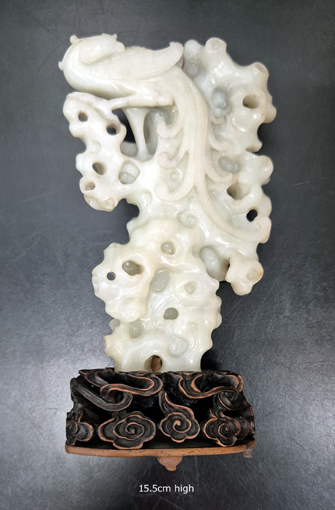 White Jade carved as a phoenix on rockwork. 