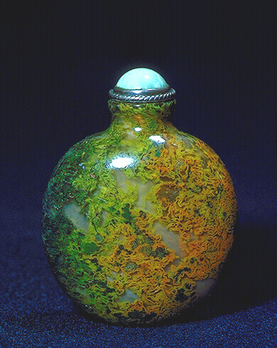 A moss agate plain snuff bottle, well hollowed, with a jade and metal stopper. 