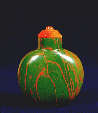 A plain quartz, jasper, plain ladies snuff bottle, well hollowed, with a carnelian stopper. 