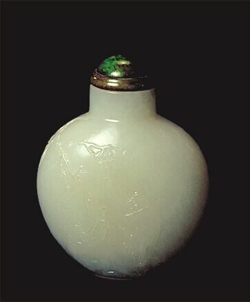 A good pure white nephrite snuff bottle, well hollowed, with two monkeys and a peach in low relief. Jade, set in a metal collar, stopper. 