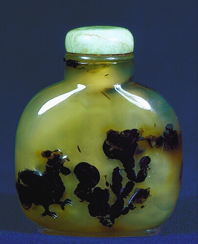 A chalcedony well hollowed silhouette humorous cockerel picture snuff bottle with a jade and horn stopper. 