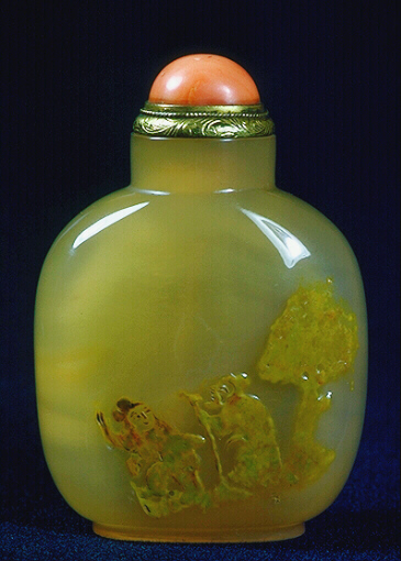 A chalcedony well hollowed silhouette two sages under a tree picture snuff bottle with a coral and metal stopper. 