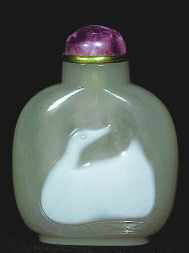 A chalcedony well hollowed cameo carved white duck picture snuff bottle with an amethyst and metal stopper. 