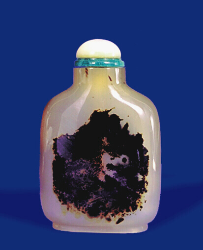 A chalcedony well hollowed silhouette hare picture snuff bottle with abalone on glass imitating jadeite stopper.