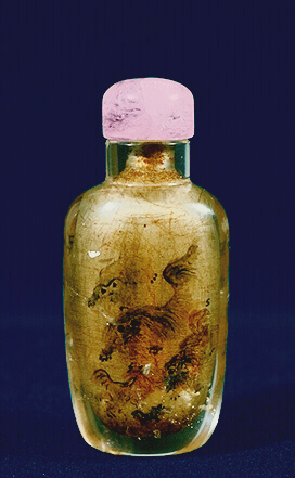 Quartz, rock crystal early inside painted snuff bottle, painted inside with tones of sepia and grisaille with Buddhist lions at play, the reverse with an inscription.