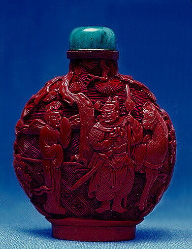 Cinnabar lacquer snuff bottle, carved with a warrior and horse under a pine tree, a beautiful girl with hand raised to her eyes; the reverse with two ladies; the background of formalized cloud patterns.