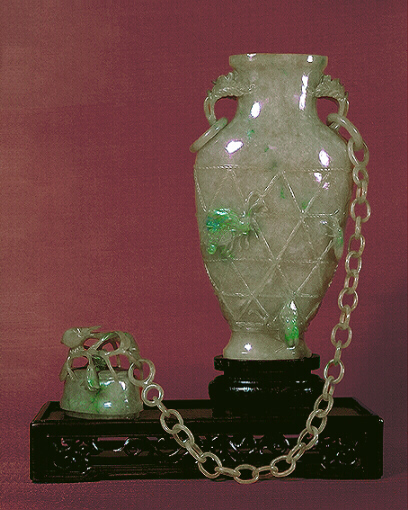 Celadon jadeite chained vase with rope strap work and cover, with 28 links, hints of lavender and apple green, well hollowed.