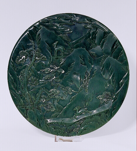 Reverse: Spinach green jade circular screen with figures in a mountain landscape. Qianlong period.