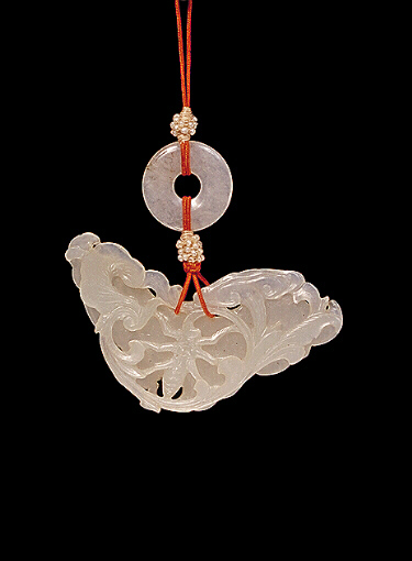 Reverse: Nephrite Pendant, white carved in the form of a butterfly with long proboscis, the other side with a beetle amongst scrolling flowers and ruyi fungus.