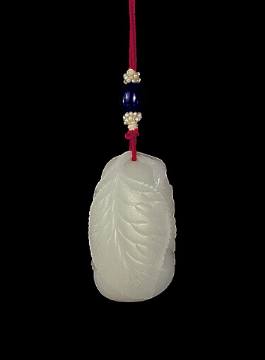 Reverse: Nephrite Pendant, mutton fat, carved in the form of a silk moth and two worms interlocked in a yin yang style on a flowering mulberry leaf.