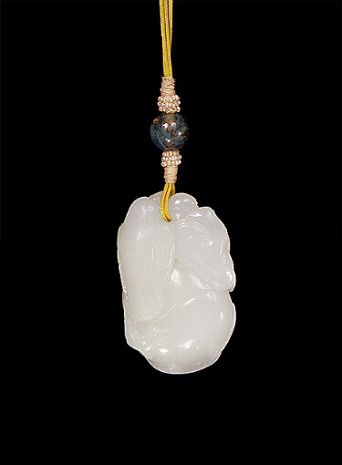 Nephrite Pendant, mutton fat, carved with a large peach and two smaller peaches and a sturdy looking bird clinging to the edge with a ruyi fungus.