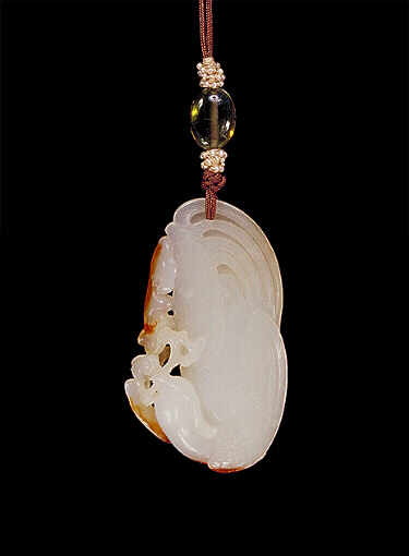 Nephrite Pendant, white with small russet areas carved as a beautiful stylised bird with ruyi fungus in its beak.