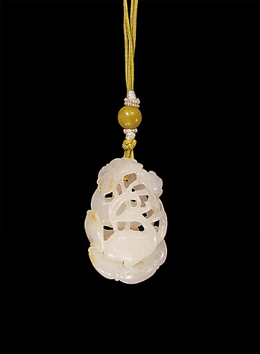 White Nephrite pendant carved as two egrets amongst lotus.