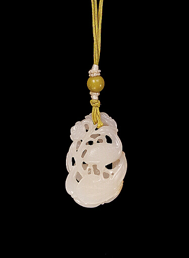 Reverse: White Nephrite pendant carved as two egrets amongst lotus.