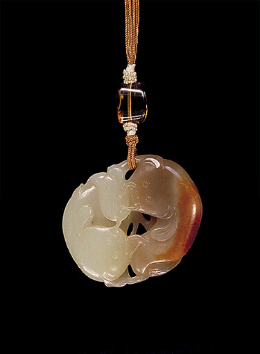 Celadon and dark brown Nephrite pendant carved using the colours as two fan-tailed carp.