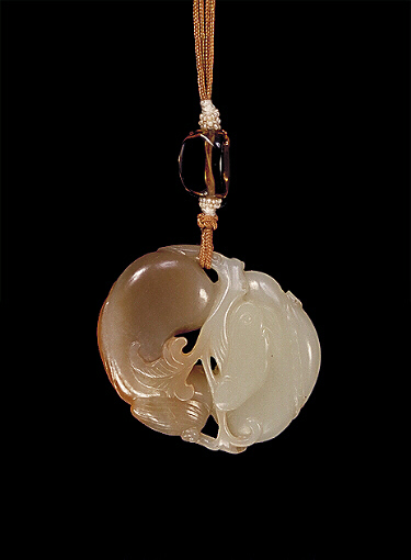 Reverse: Celadon and dark brown Nephrite pendant carved using the colours as two fan-tailed carp.