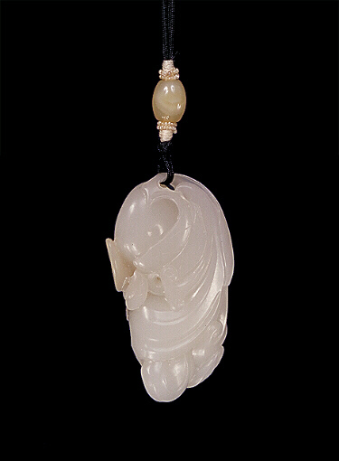 Reverse: Nephrite pendant, mutton fat with some russet skin areas carved as a persimmon fruit with a beetle on iits leaf. 