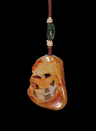 Nephrite pendant, pierced white and brown russet skin carved with a butterfly and a silk worm around mulberry leaves and fruit.