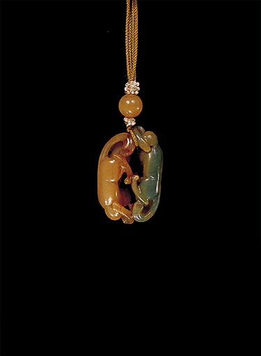 Reverse: Nephrite pendant, pale beige colour with an olive green side, charmingly carved as two cats, their paws touching.