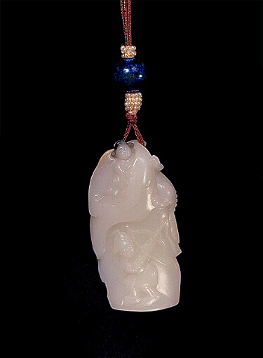 Reverse: Nephrite pendant, white mutton fat with darker grey and russet, carved with a rabbit at the foot and a kylin at the top near a gnarled tree. The other side with a hunter and bow trying to find a person hiding up by rocks. The foot with a seal carved for the artist. Suzhou School.