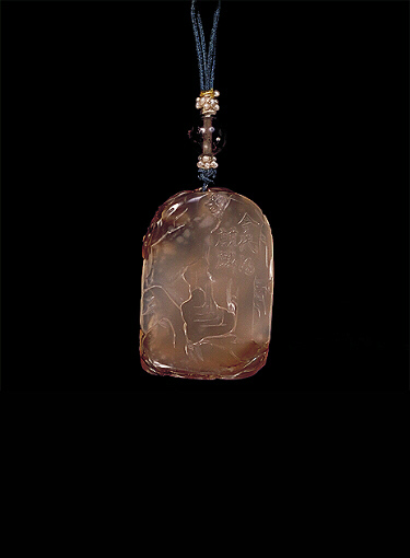 Reverse: Chalcedony pendant, pale translucent colour with darker brown skin, carved as a kylin with ruyi fungus and clouds above. The reverse with a rocky cavernous area and a raised inscription to one side. Suzhou School.