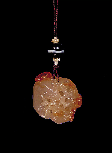 Chalcedony pendant, pale translucent agate with russet inclusions carved with two feline animals, together with ruyi fungus.