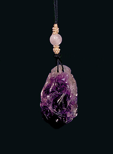 Reverse: Amethyst pendant, with milky inclusions and a dark purple area carved with a bat amongst a double gourd vine, the bottom of the pendant forming the deeper colour and the larger part of the gourd.