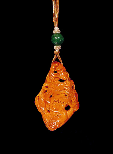 Reverse: Amber pendant, of dark translucent golden colour with opaque paler material carved with a tiger from the translucent material and a dragon amongst clouds from the opaque material, the foot carved with a personal seal.