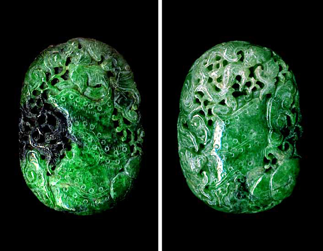 Nephrite pendant, green and black stone carved as bats and ruyi fungus around bamboo.