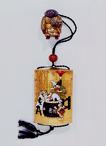 Tokusai Shibayama Theatrical Inro with a lacquer netsuke of a boy holding a box.