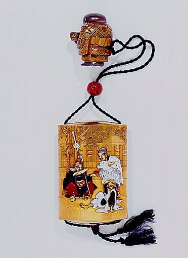 Reverse: Tokusai Shibayama Theatrical Inro with a lacquer netsuke of a boy holding a box.