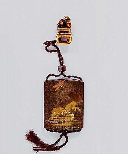 Inro decorated in gold and silver with Shishi and dragonfly, with an ivory netsuke shishi.