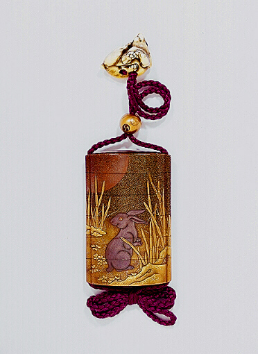 Reverse: Japanese Inro, two hares among tokusa grass beneath the Moon, with an ivory hare netsuke.