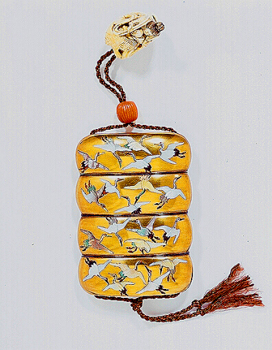 Japanese inro decorated in mother of pearl with cranes in flight, with an ivory netsuke.