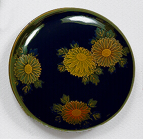 Japanese Lacquer: A togidashi Kobako of circular form, decorated all over with kiku blooms.