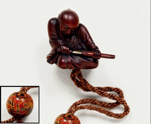 Wood Netsuke of a Man Drawing a Sword From its Scabbard