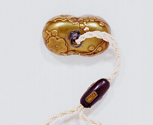 Reverse Lacquer Netsuke of Two Blossoms