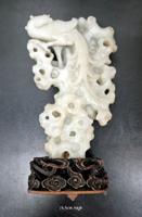 White Jade carved as a phoenix on rockwork. 