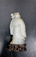 Reverse: Light Grey Nephrite carved as a sage with his assistant. 